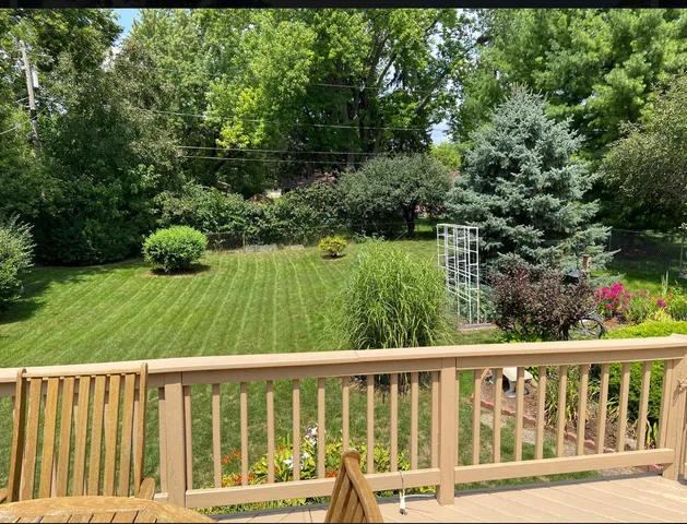 a view of balcony with a yard