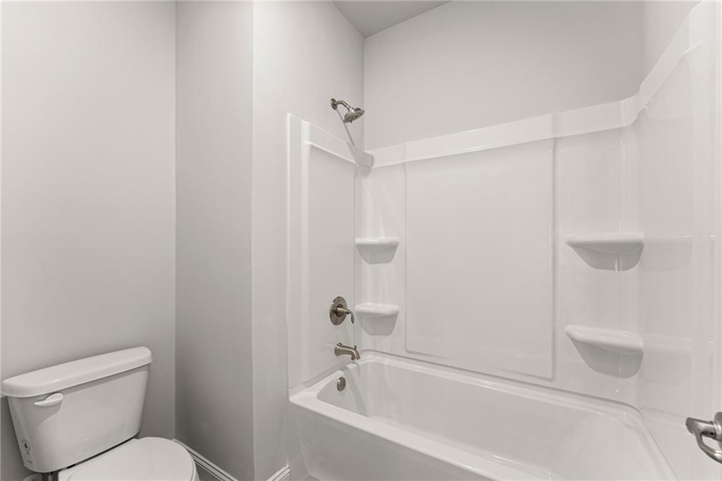 661 Forest Way Cornelia, GA 30531 - Photo 28 of 45 a white bath tub sitting next to a toilet