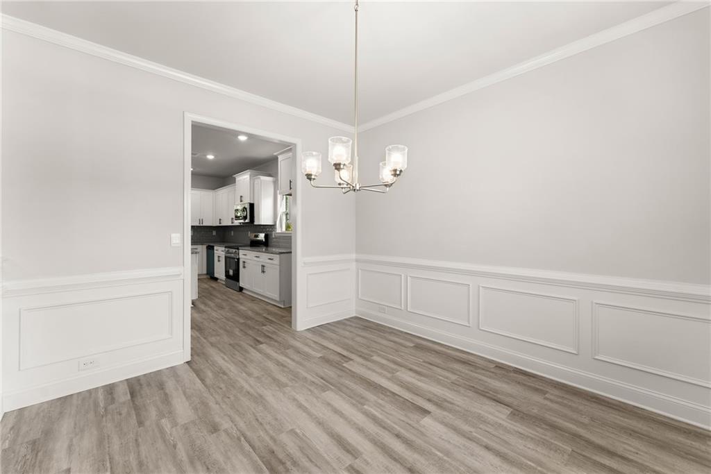 661 Forest Way Cornelia, GA 30531 - Photo 7 of 45 a view of a kitchen cabinets and wooden floor