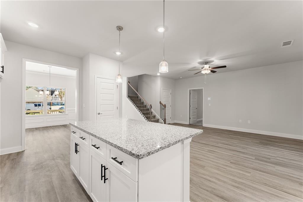 661 Forest Way Cornelia, GA 30531 - Photo 10 of 45 an entryway with staircase and kitchen view
