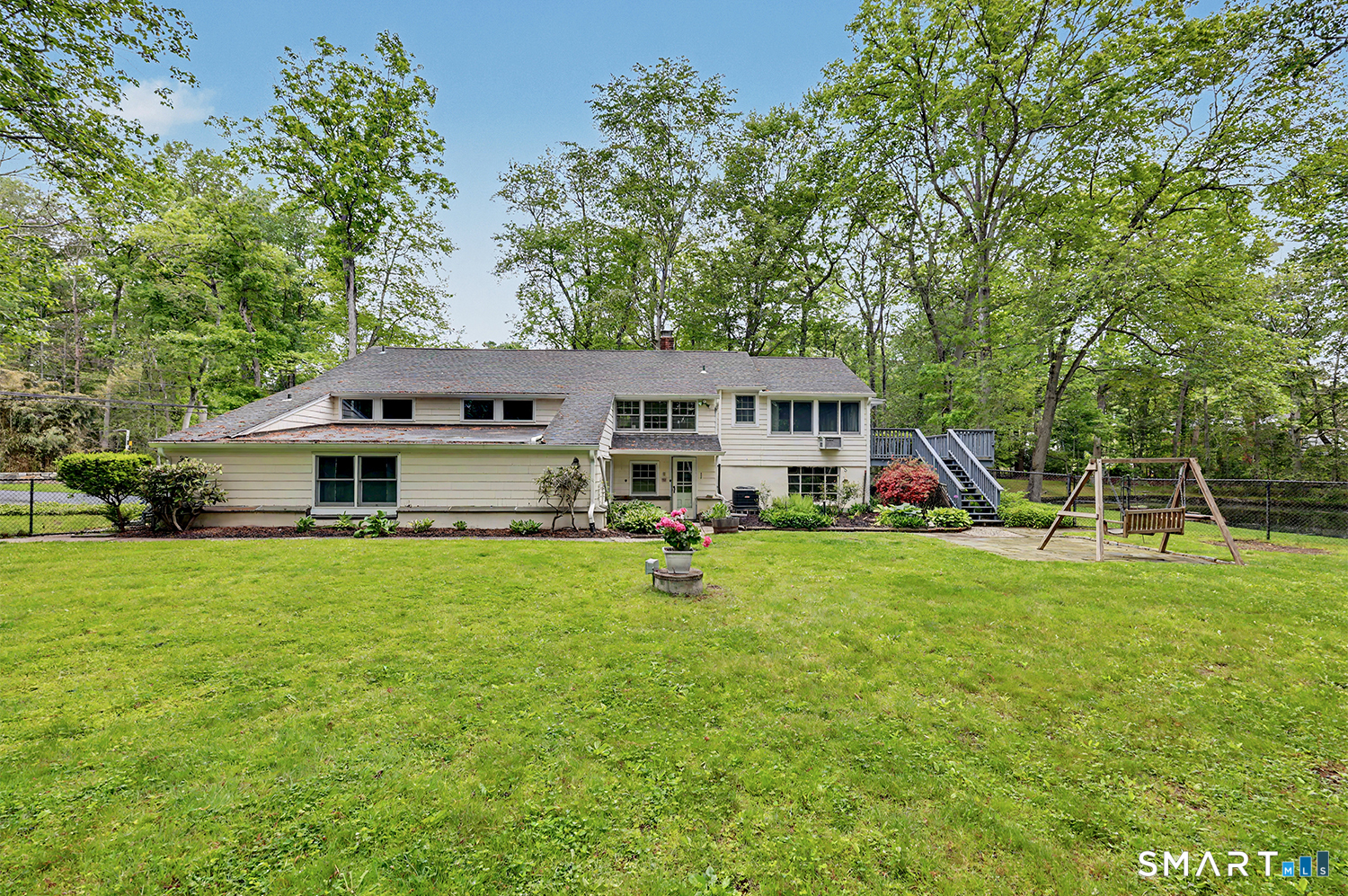 19 Geneva Road Norwalk, CT 06850 - Photo 4 of 33 a view of a house with a big yard and large trees
