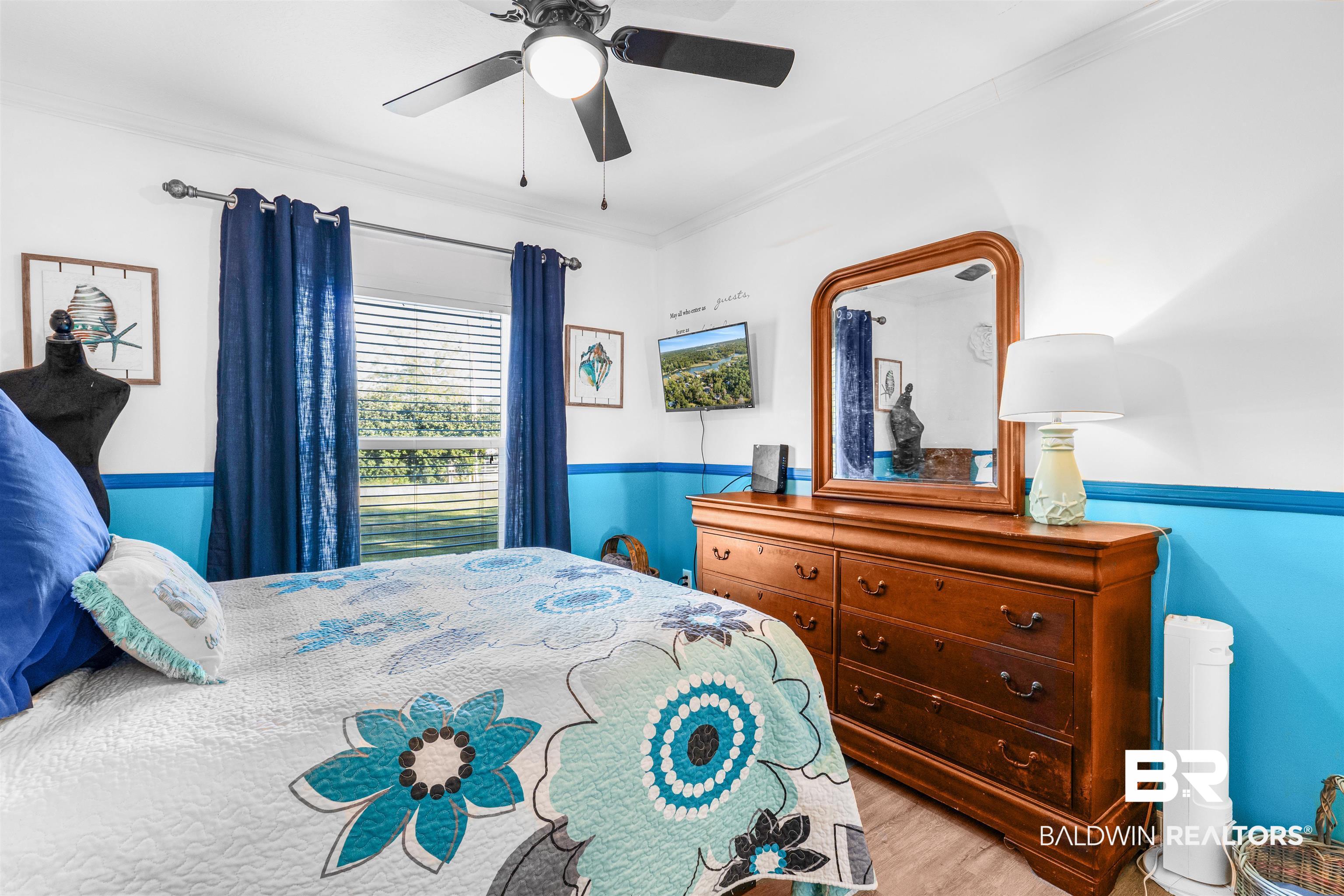 6921 Piney Woods Road Foley, AL 36535 - Photo 22 of 44 Bedroom featuring light hardwood / wood-style floors, ornamental molding, and ceiling fan