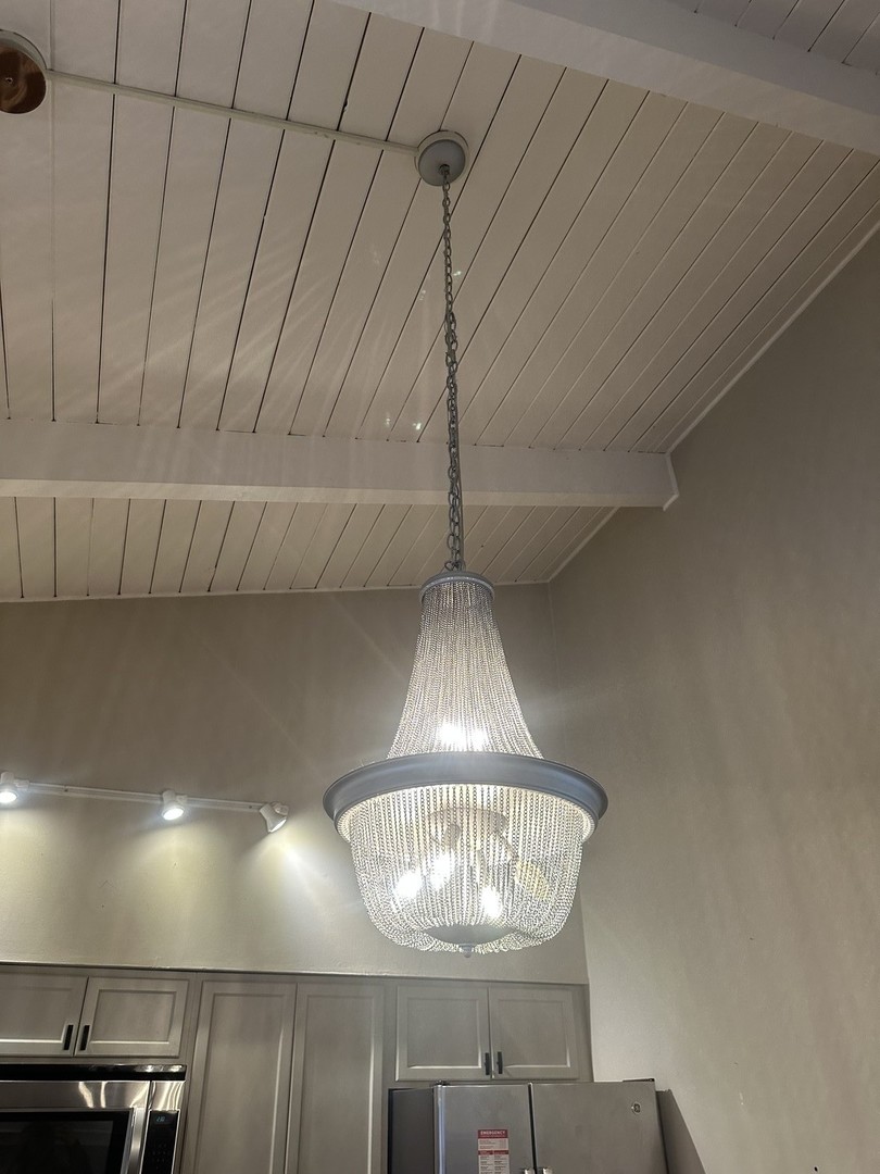 2211 Benjamin Lane Bloomington, IL 61701 - Photo 16 of 50 a room with a chandelier