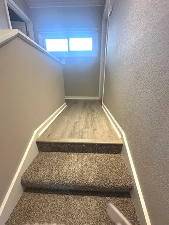 an empty room with wooden floor