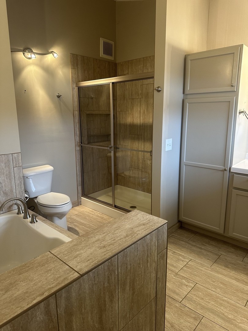 2211 Benjamin Lane Bloomington, IL 61701 - Photo 22 of 50 a bathroom with a granite countertop sink and a mirror