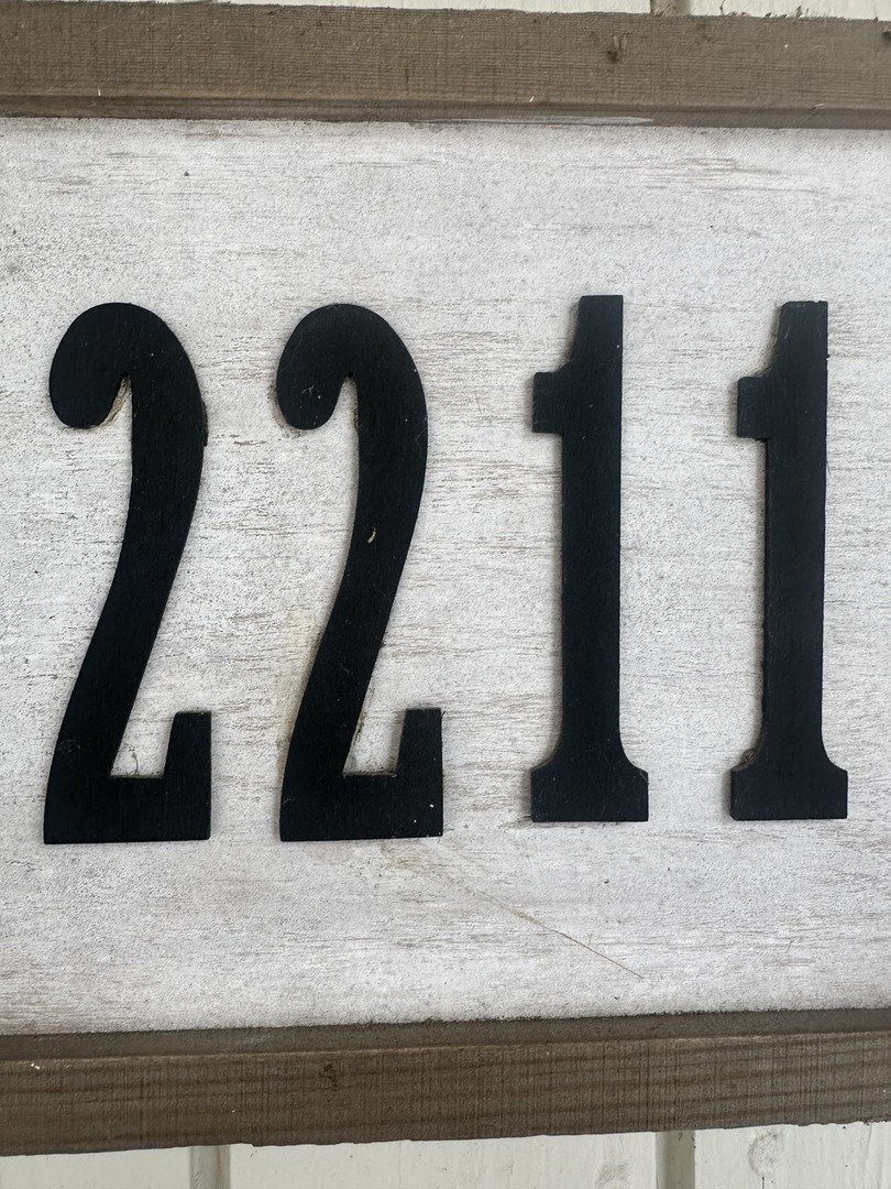 2211 Benjamin Lane Bloomington, IL 61701 - Photo 3 of 50 a close view of sink and mirror
