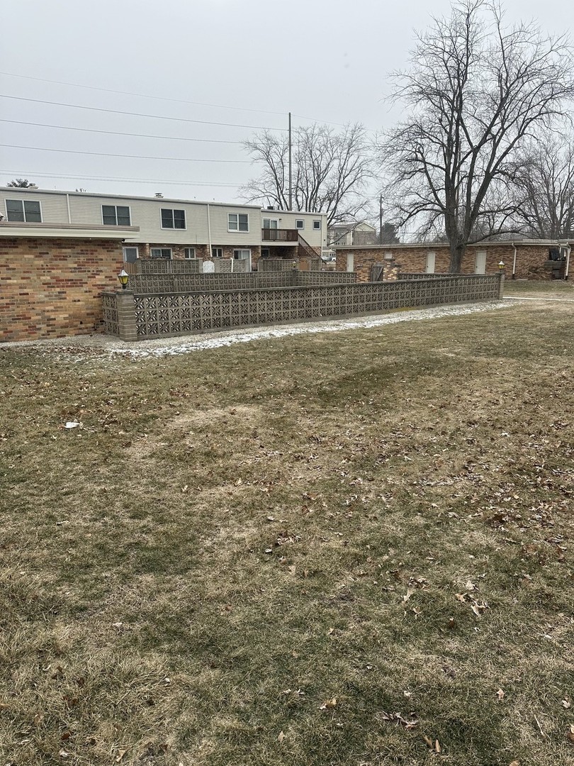 2211 Benjamin Lane Bloomington, IL 61701 - Photo 48 of 50 a view of a yard with wooden fence