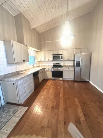 a view of entryway with wooden floor