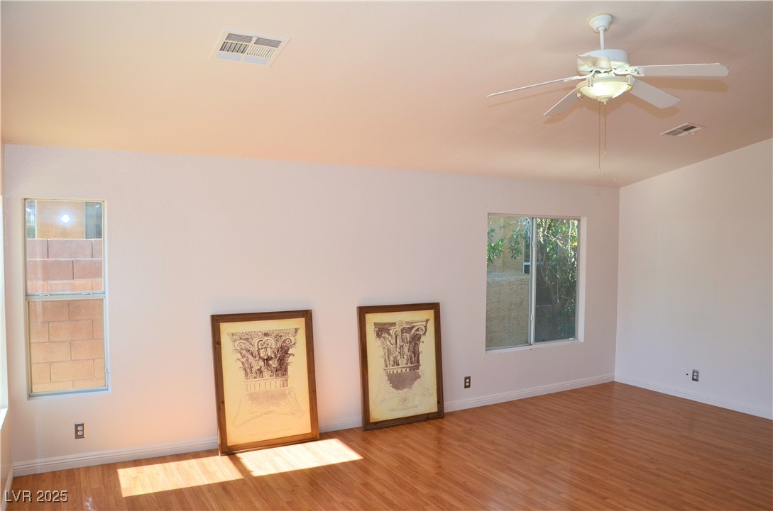 7340 Alpine Ridge Street Las Vegas, NV 89131 - Photo 12 of 36 Living room has vaulted ceilings throughout.