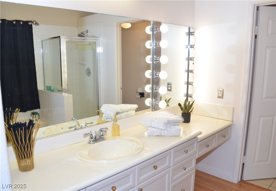 7340 Alpine Ridge Street Las Vegas, NV 89131 - Photo 17 of 36 Enjoy a spacious ensuite with a separate vanity area ideal for makeup and personal care.