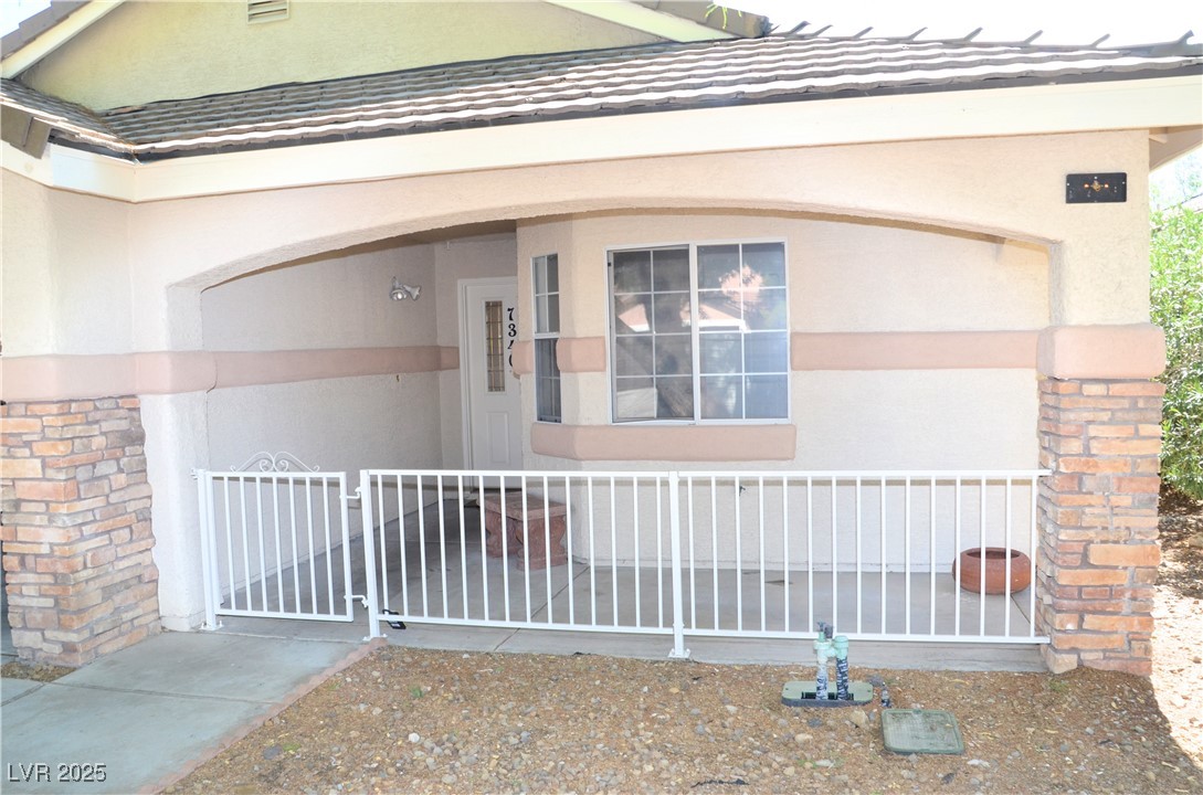 7340 Alpine Ridge Street Las Vegas, NV 89131 - Photo 2 of 36 Lovely gated entry.