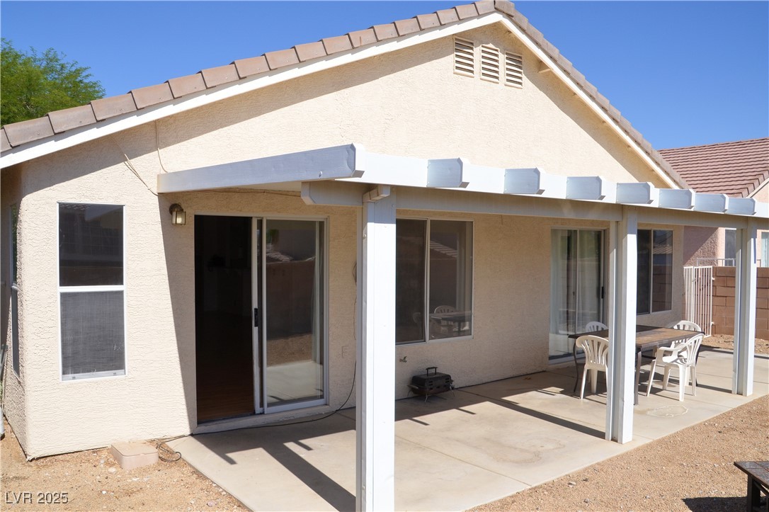 7340 Alpine Ridge Street Las Vegas, NV 89131 - Photo 33 of 36 Full length patio cover.