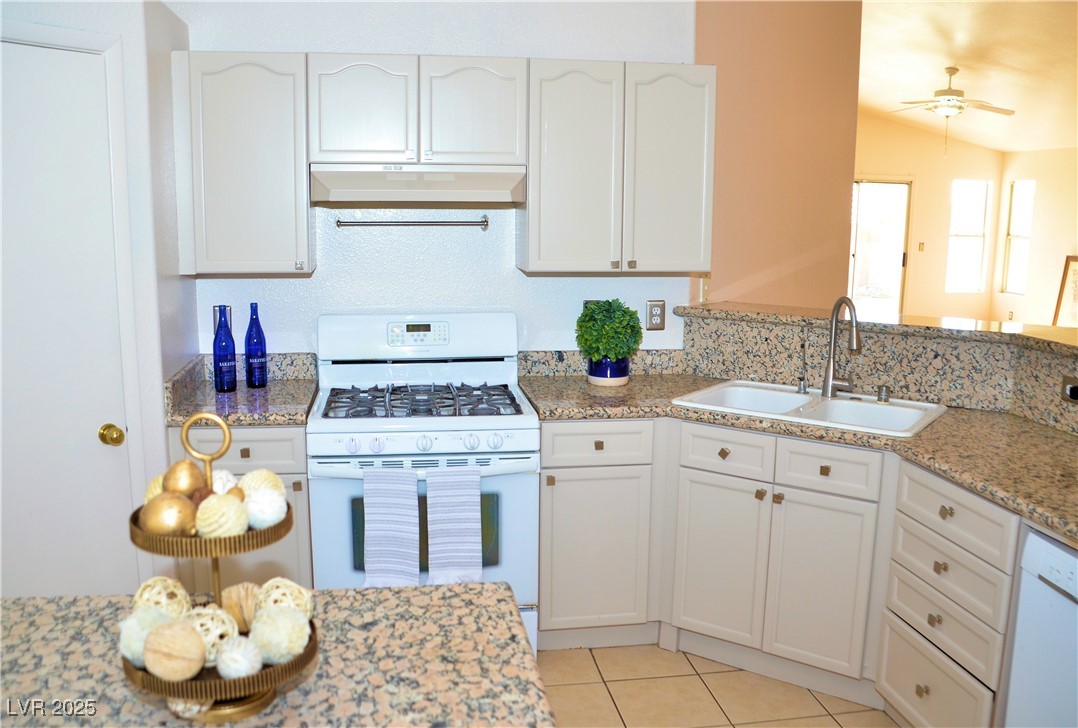 7340 Alpine Ridge Street Las Vegas, NV 89131 - Photo 5 of 36 Granite counters throughout the kitchen.