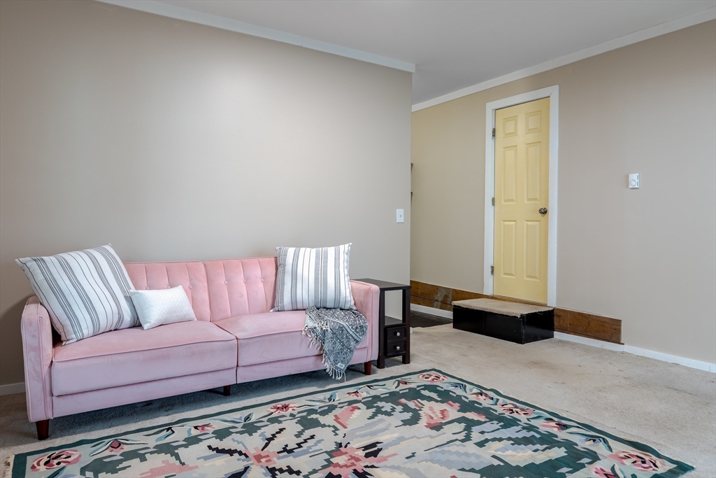 85 Colonial Drive Littleton, MA 01460 - Photo 18 of 26 a living room with a couch