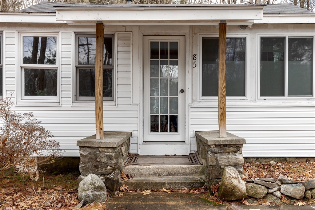 85 Colonial Drive Littleton, MA 01460 - Photo 2 of 26 a view of a house with a patio