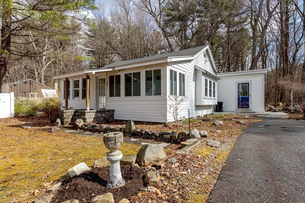 85 Colonial Drive Littleton, MA 01460 - Photo 21 of 26 a front view of a house with swimming pool