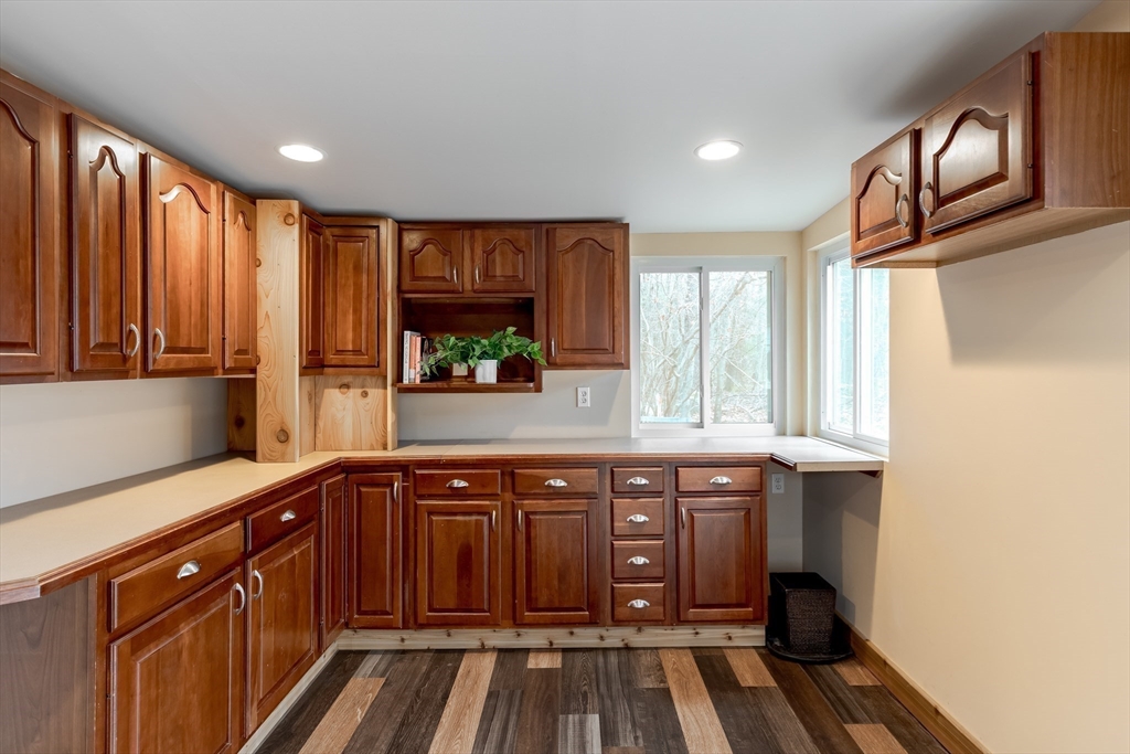 85 Colonial Drive Littleton, MA 01460 - Photo 10 of 26 a kitchen with stainless steel appliances granite countertop a stove and a sink