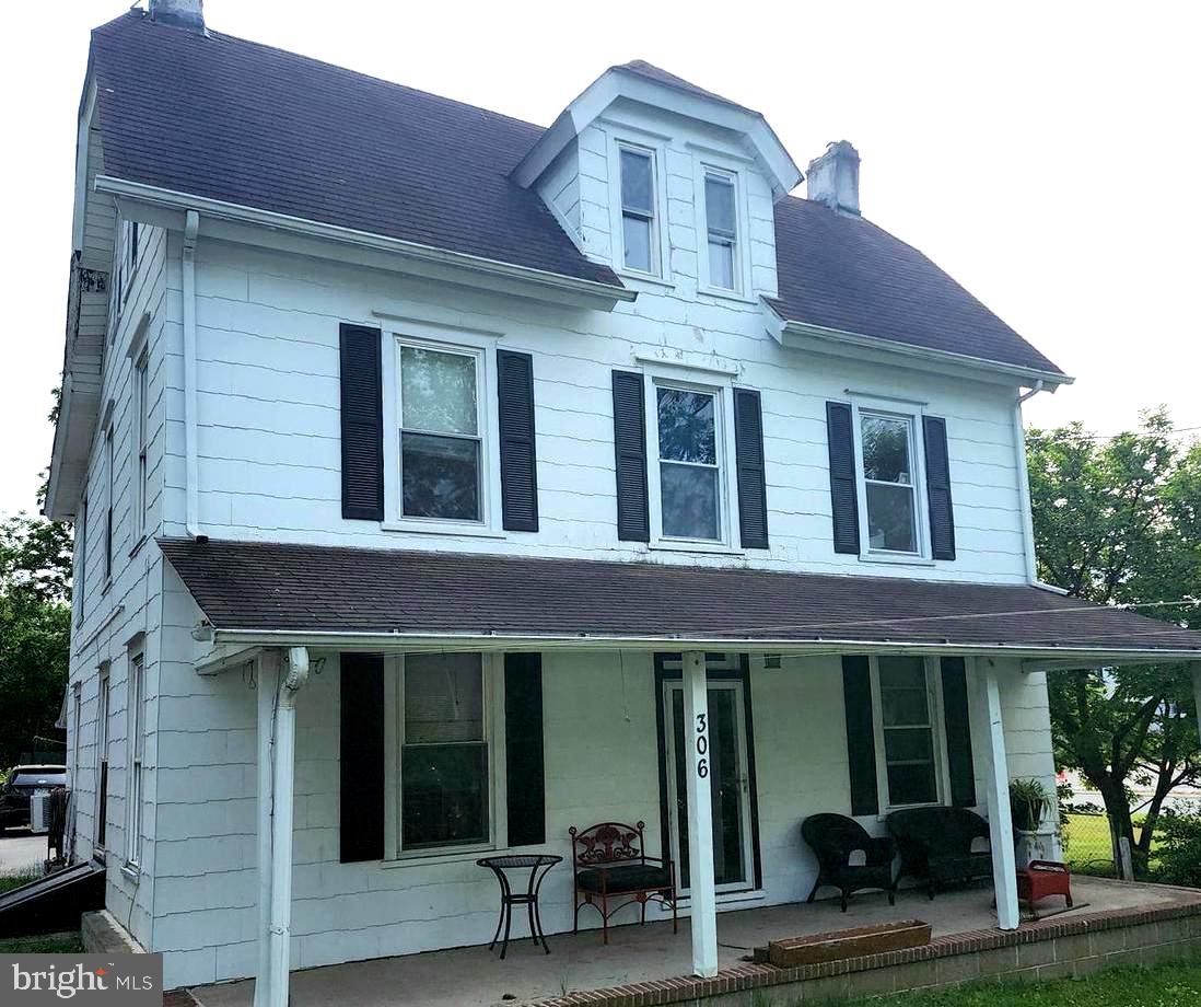 a front view of a house with a porch