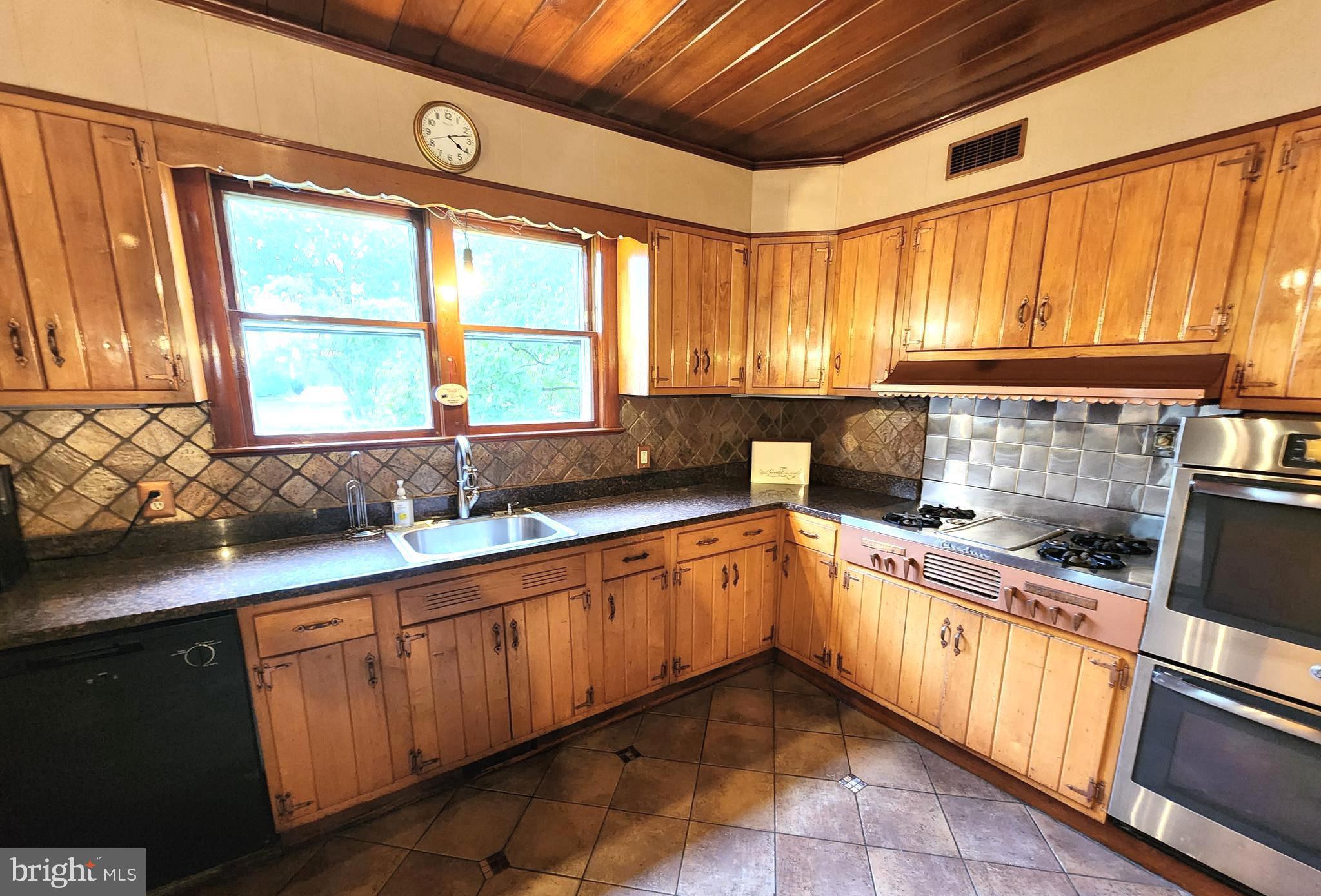 306 Middletown Road Media, PA 19063 - Photo 13 of 22 a kitchen with a sink a counter top space and stainless steel appliances
