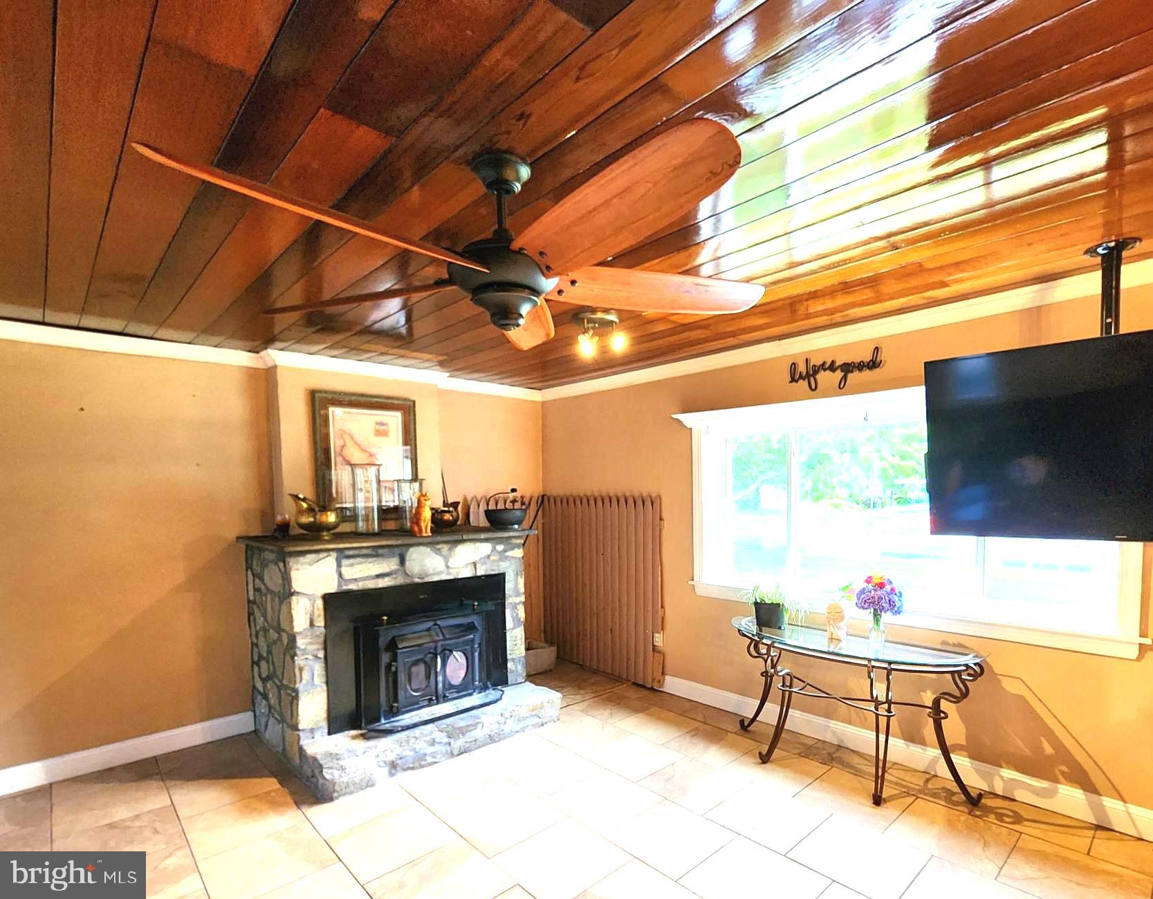 306 Middletown Road Media, PA 19063 - Photo 14 of 22 a living room with furniture a flat screen tv and a fireplace