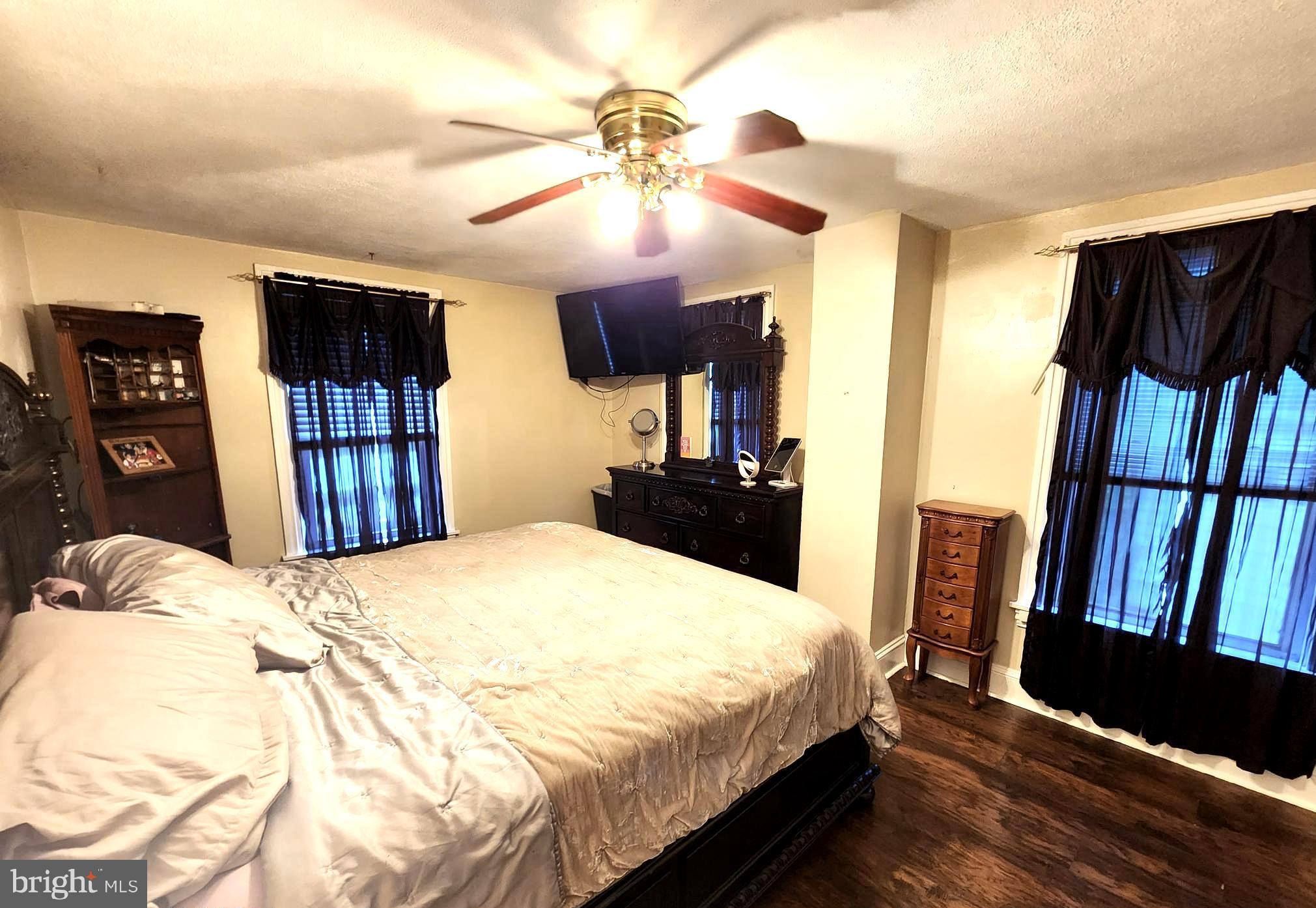 306 Middletown Road Media, PA 19063 - Photo 17 of 22 a bedroom with a large bed a flat tv screen and dresser