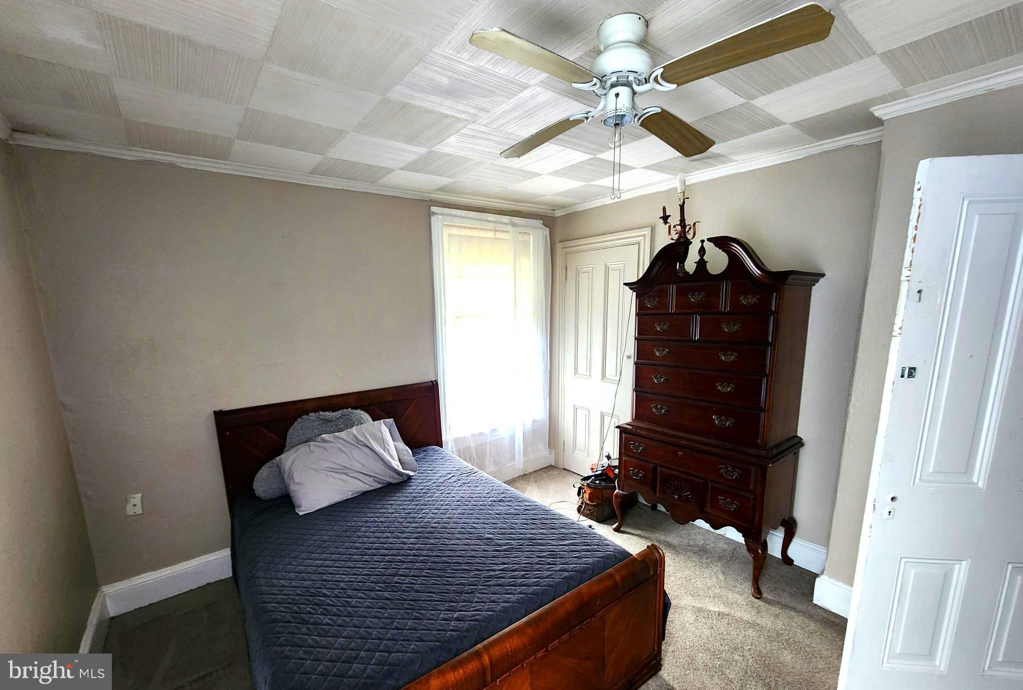 306 Middletown Road Media, PA 19063 - Photo 18 of 22 a bedroom with a bed and a chandelier