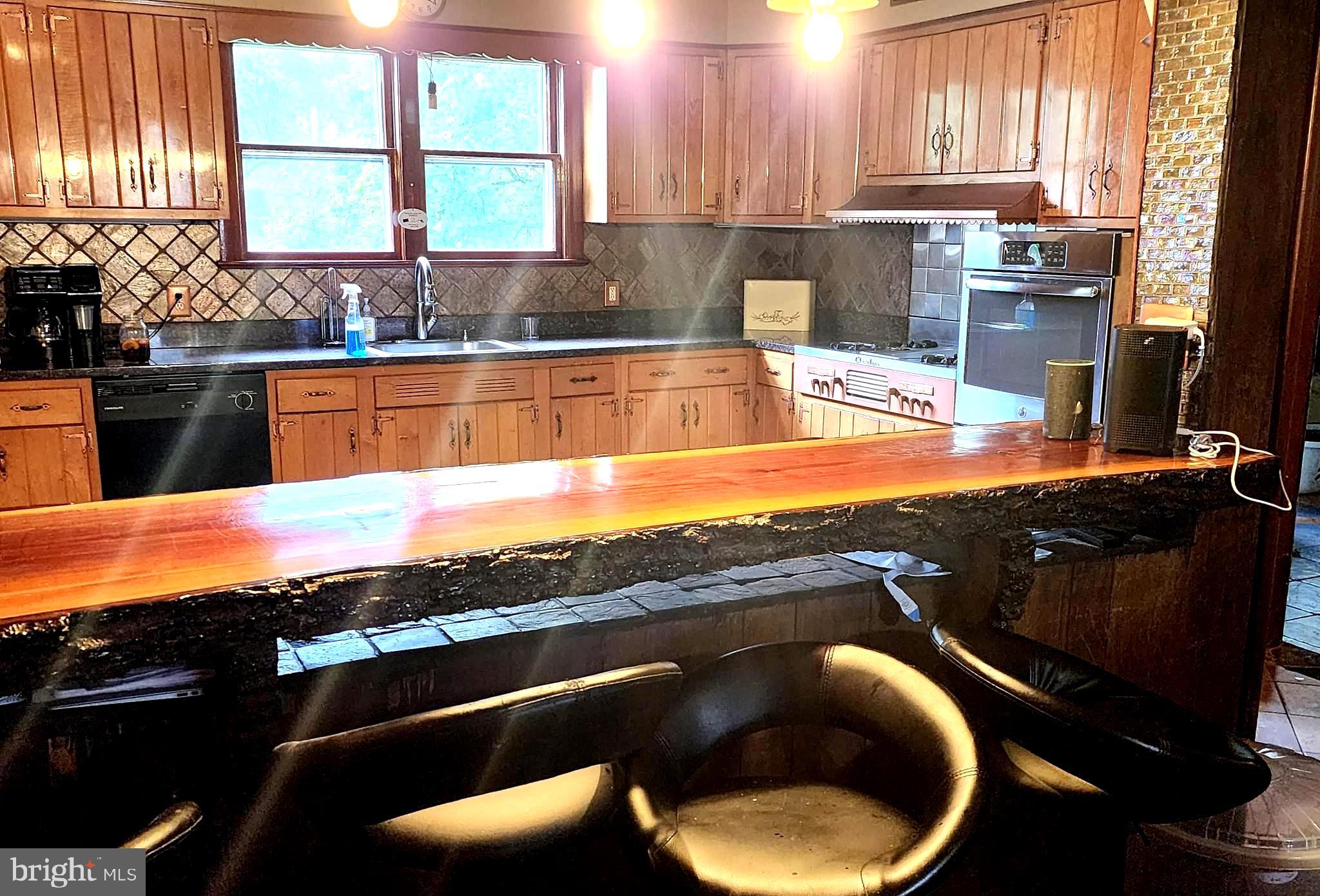 306 Middletown Road Media, PA 19063 - Photo 5 of 22 a kitchen with stainless steel appliances granite countertop a sink a stove and a microwave