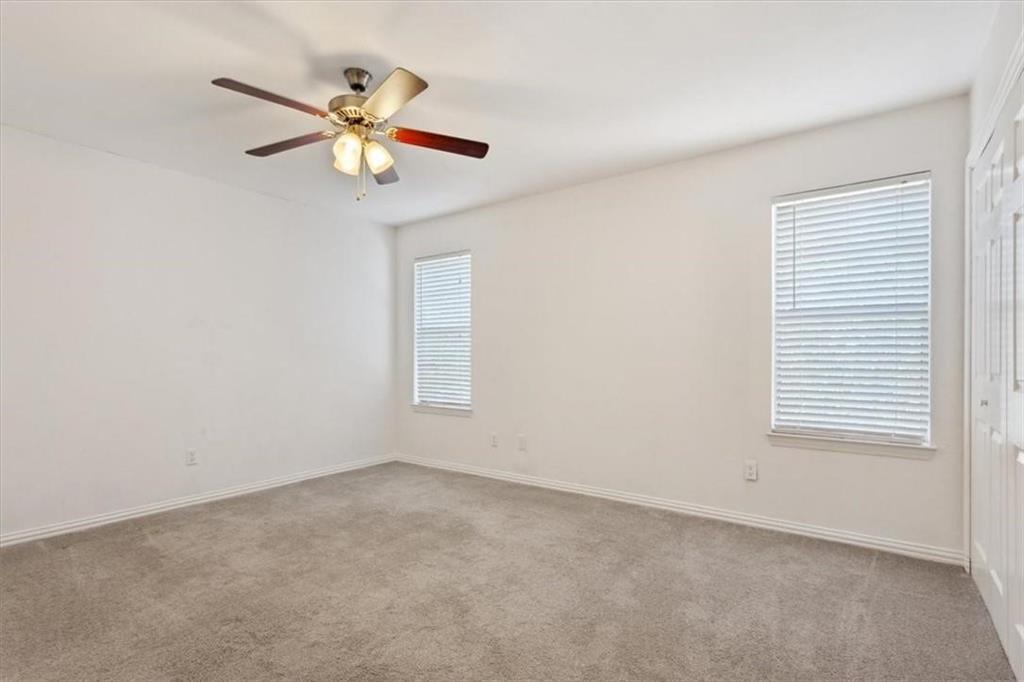 2306 Melissa Drive Waco, TX 76708 - Photo 13 of 22 an empty room with a window and a fan