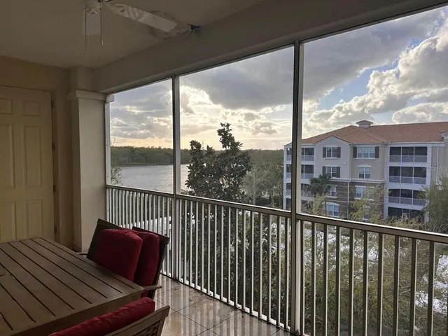 a view of a balcony with wooden floor