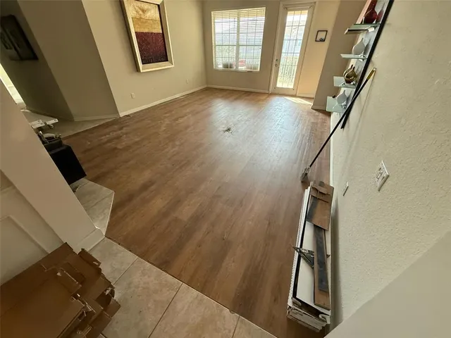 a view of an entryway with wooden floor