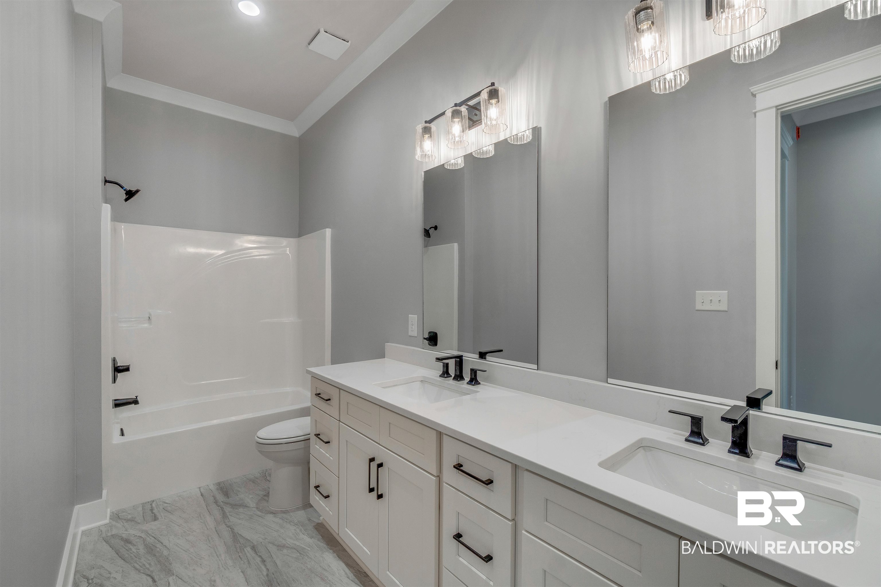 10985 Atrium Avenue Fairhope, AL 36532 - Photo 34 of 58 Bathroom with double vanity, shower / washtub combination, ornamental molding, and recessed lighting