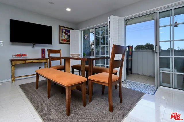 a workspace with furniture and a potted plant