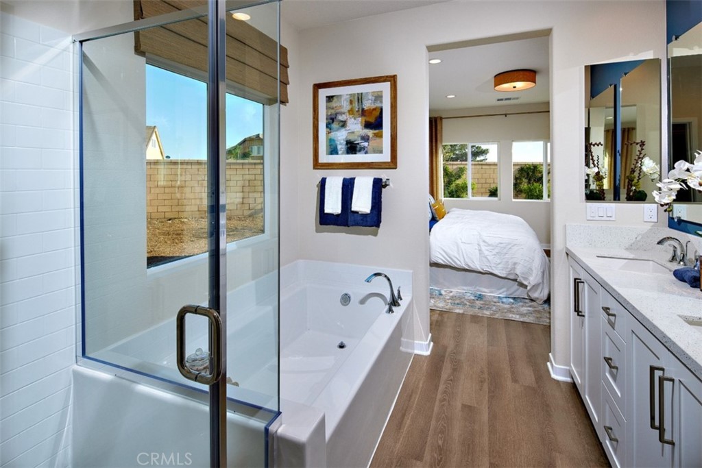 35266 Funk Way Beaumont, CA 92223 - Photo 11 of 19 a spacious bathroom with a tub sink and a mirror