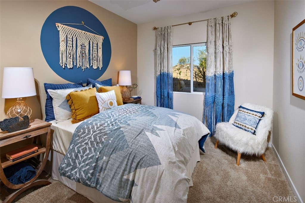 35266 Funk Way Beaumont, CA 92223 - Photo 16 of 19 a bedroom with a bed and dresser