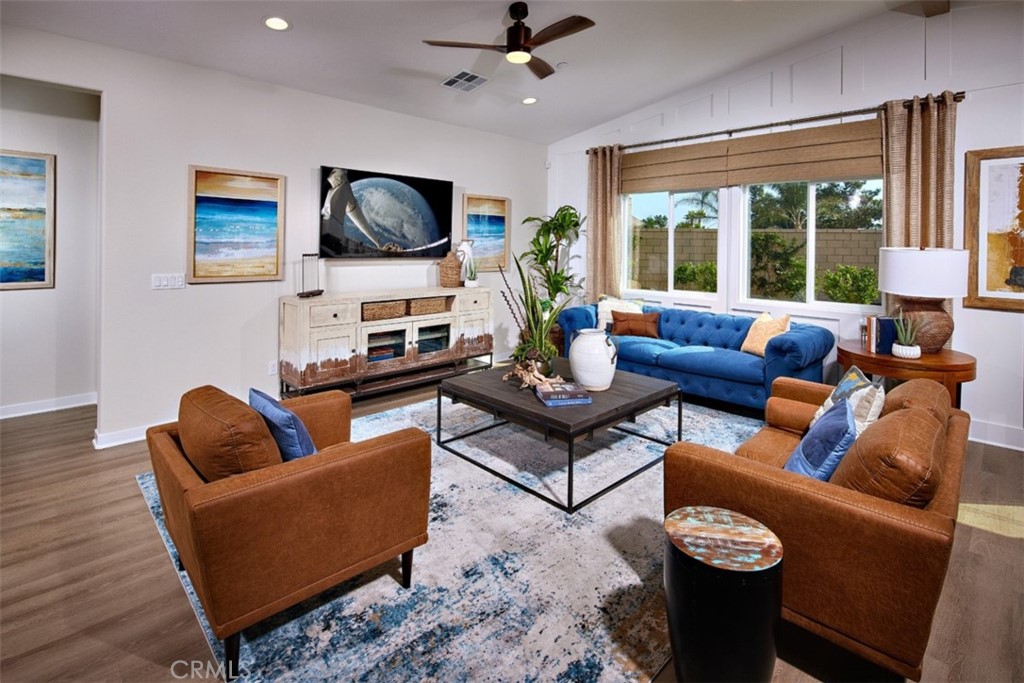 35266 Funk Way Beaumont, CA 92223 - Photo 3 of 19 a living room with furniture a flat screen tv and a large window