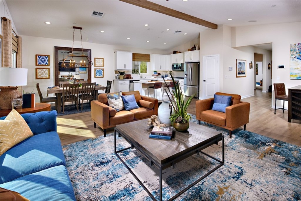 35266 Funk Way Beaumont, CA 92223 - Photo 5 of 19 a living room with furniture kitchen view and a table
