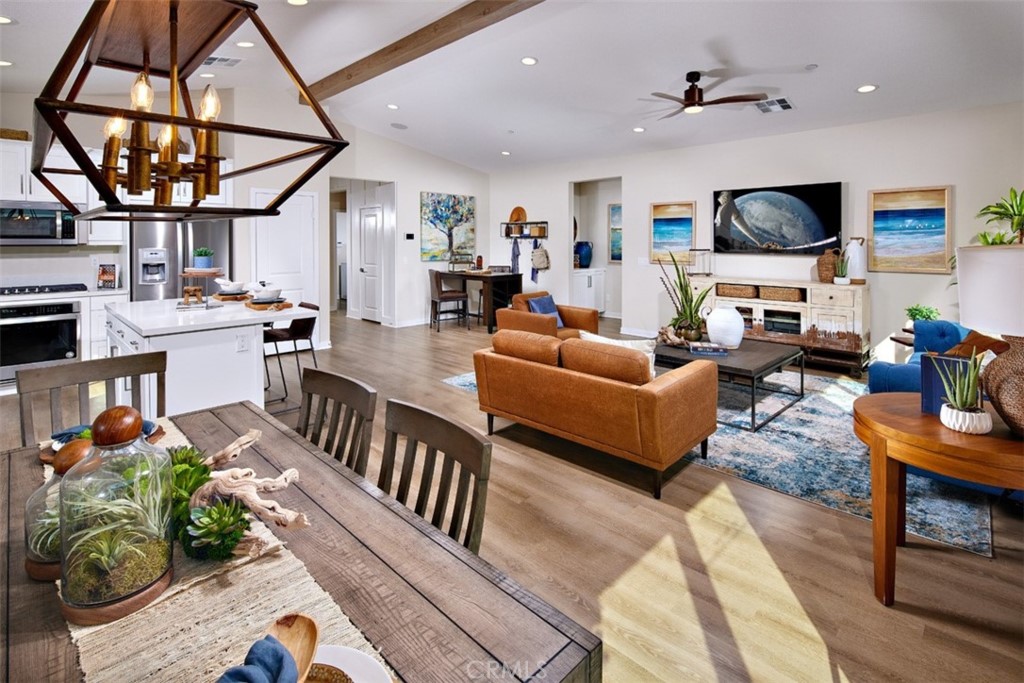 35266 Funk Way Beaumont, CA 92223 - Photo 6 of 19 a living room with fireplace furniture and a flat screen tv