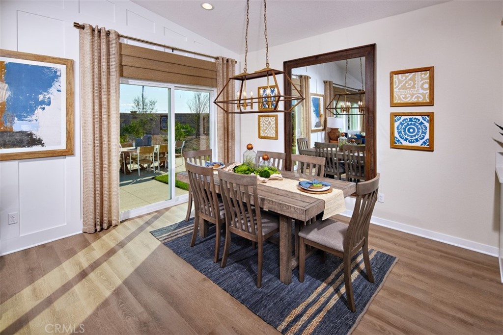 35266 Funk Way Beaumont, CA 92223 - Photo 7 of 19 a view of a dining room with furniture window and wooden floor