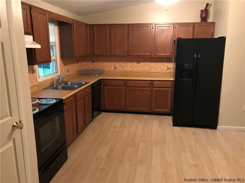 15 Chase Road Wallkill, NY 12589 - Photo 3 of 26 a kitchen with a sink and a stove top oven