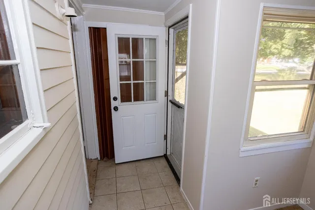 a view of a closet area with an empty room