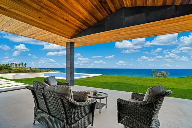 a balcony with furniture and a garden