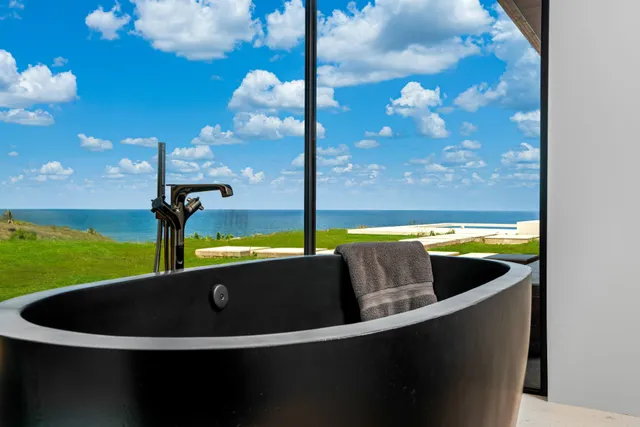 a view of a swimming pool with a yard