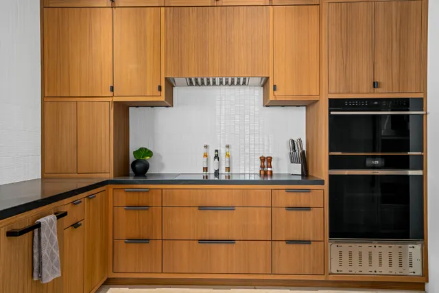 a kitchen with stainless steel appliances a refrigerator and cabinets