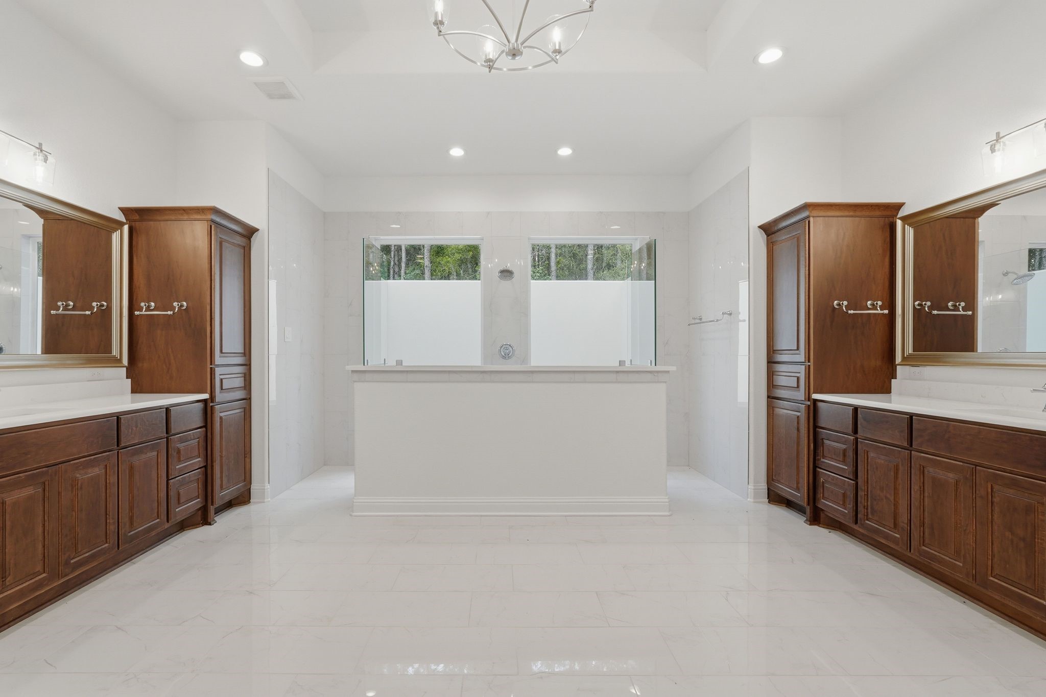 16081 Forest Mill Road Willis, TX 77378 - Photo 19 of 37 Retreat to the spa-like primary bath, offering elegant finishes, dual vanities, generous storage, and a bright, open design.