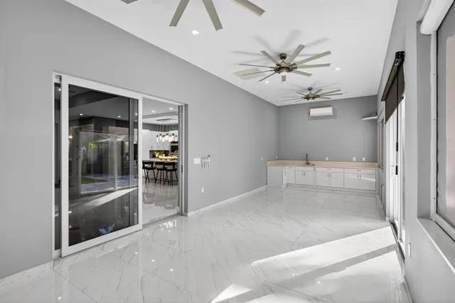 a view of an empty room with a window