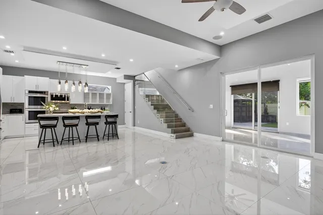a view of a dining area with furniture and a large window