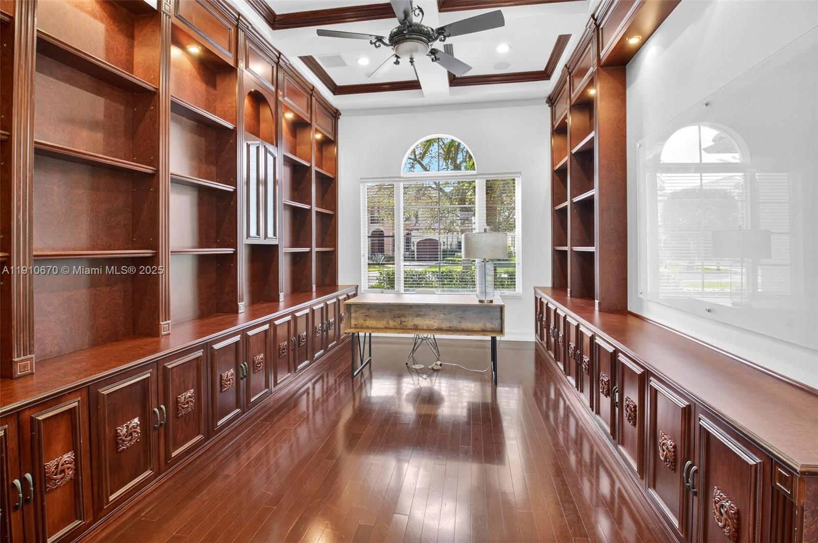 9597 Bridgebrook Drive Boca Raton, FL 33496 - Photo 12 of 88 a view of a hallway with wooden floor and windows