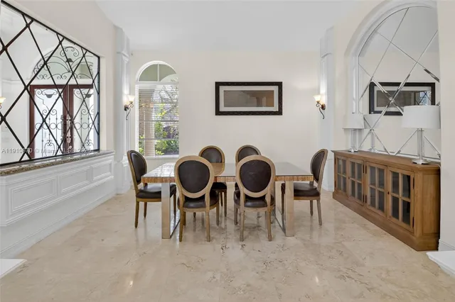 a kitchen with stainless steel appliances a stove a sink and a refrigerator