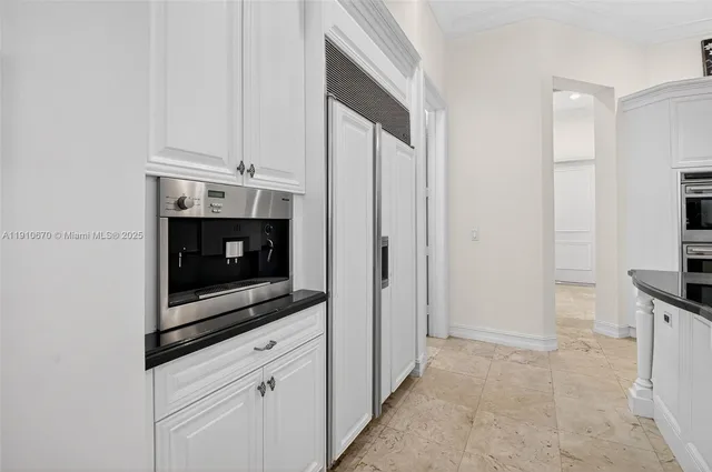 a bathroom with a granite countertop toilet a sink and a mirror