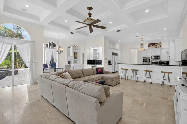 a view of living room with furniture and a fireplace